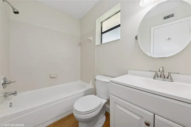 a bathroom with a sink toilet and a bathtub