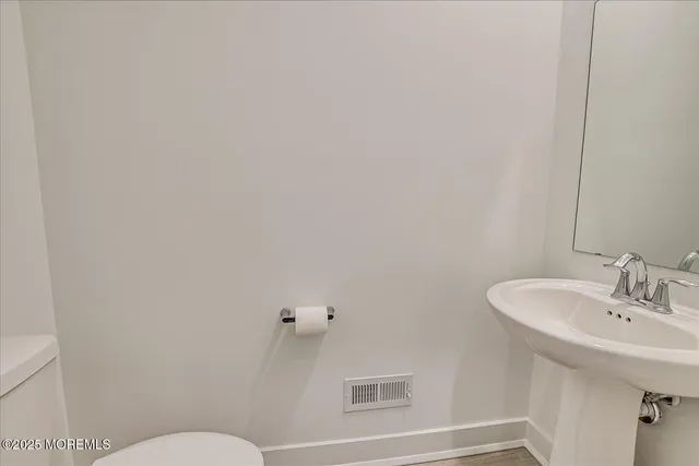 a bathroom with a sink and a toilet