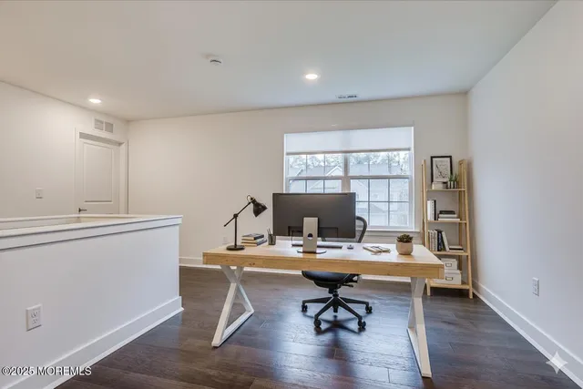 a workspace with furniture and a window