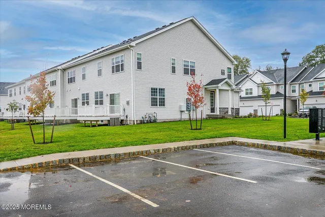 a view of a house with a backyard