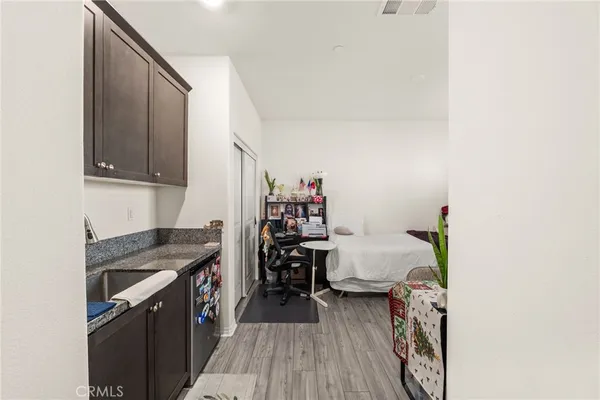 a kitchen that has a sink and a stove in it