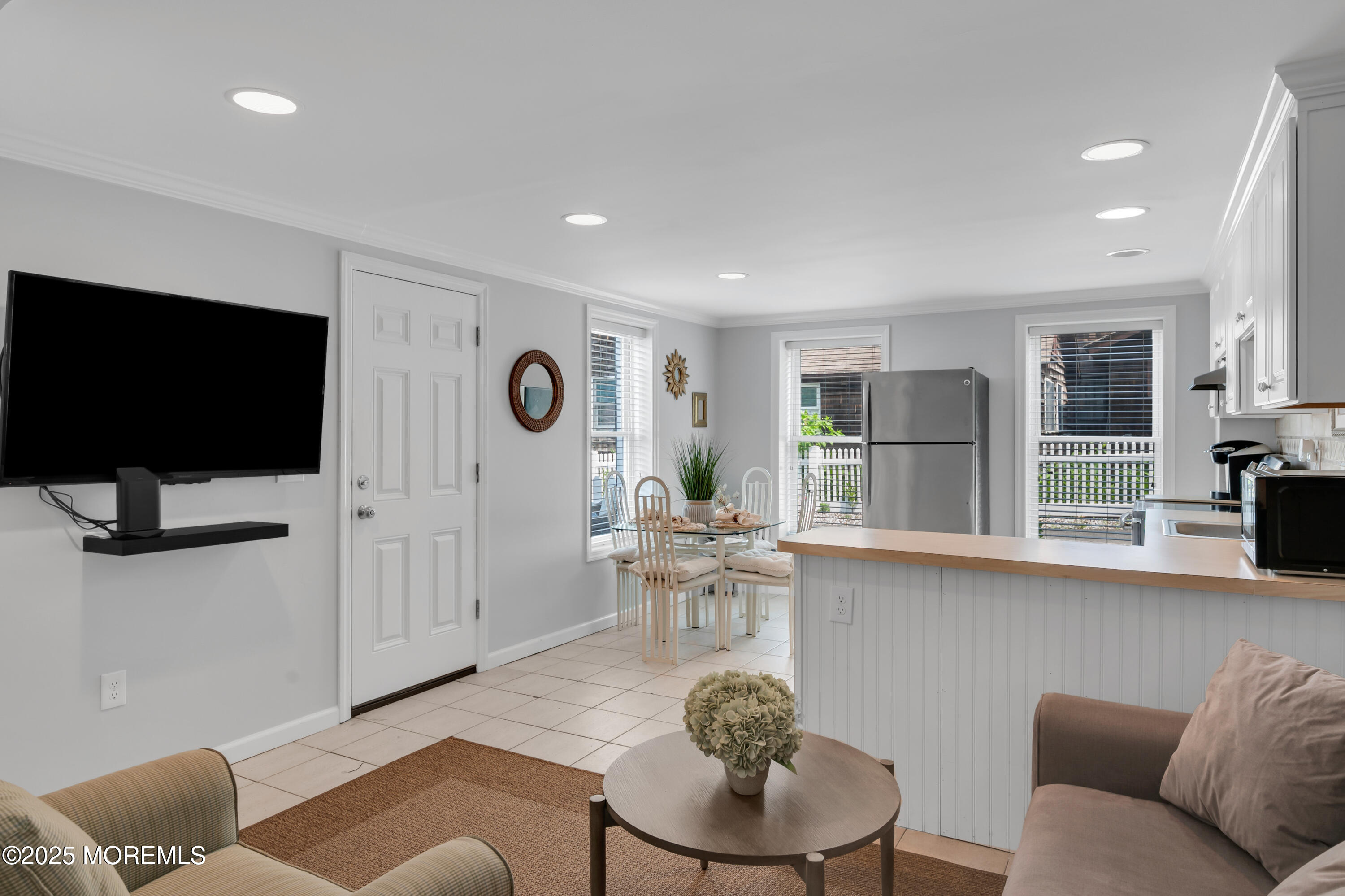 512 Main Avenue, Unit 5 Bay Head, NJ 08742 - Photo 12 of 35 a living room with furniture and a flat screen tv