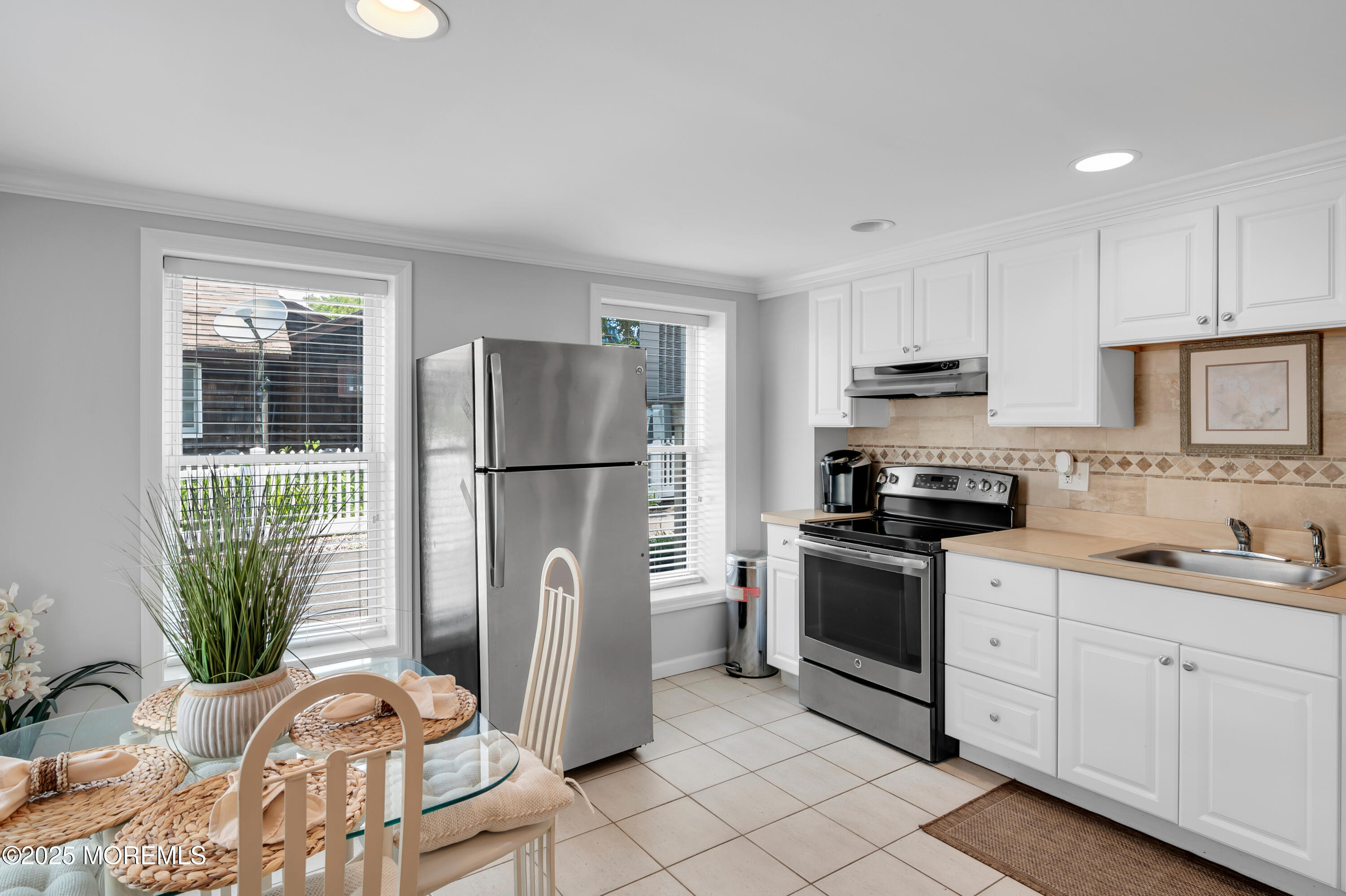 512 Main Avenue, Unit 5 Bay Head, NJ 08742 - Photo 15 of 35 a kitchen with stainless steel appliances a refrigerator sink and cabinets