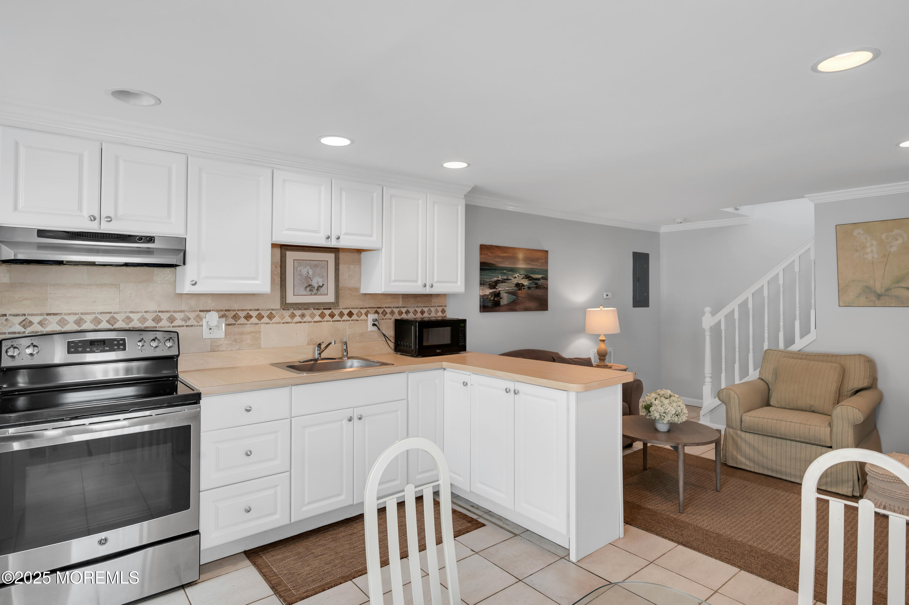 512 Main Avenue, Unit 5 Bay Head, NJ 08742 - Photo 17 of 35 a kitchen with stainless steel appliances a stove a sink cabinets and a refrigerator