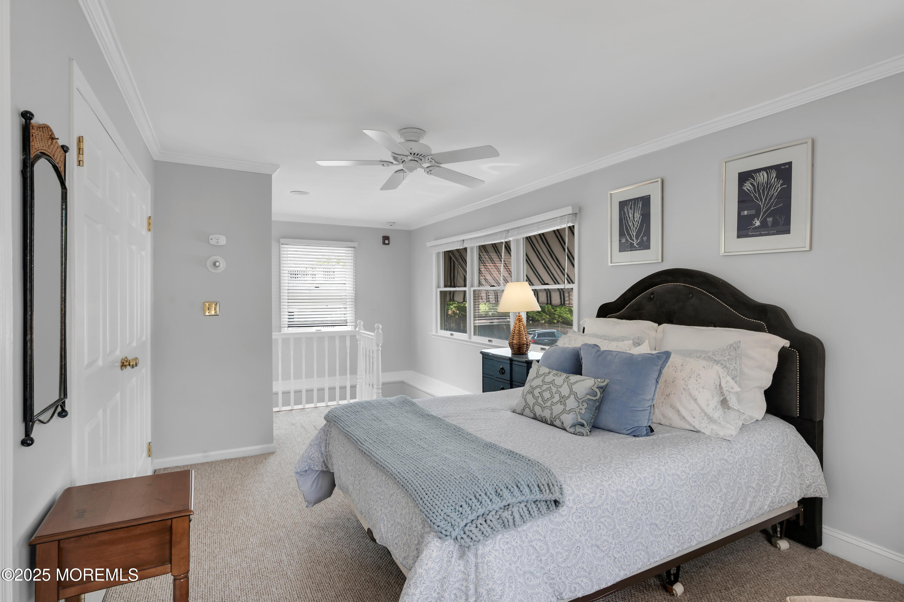 512 Main Avenue, Unit 5 Bay Head, NJ 08742 - Photo 6 of 35 a bedroom with a bed and a painting on the wall