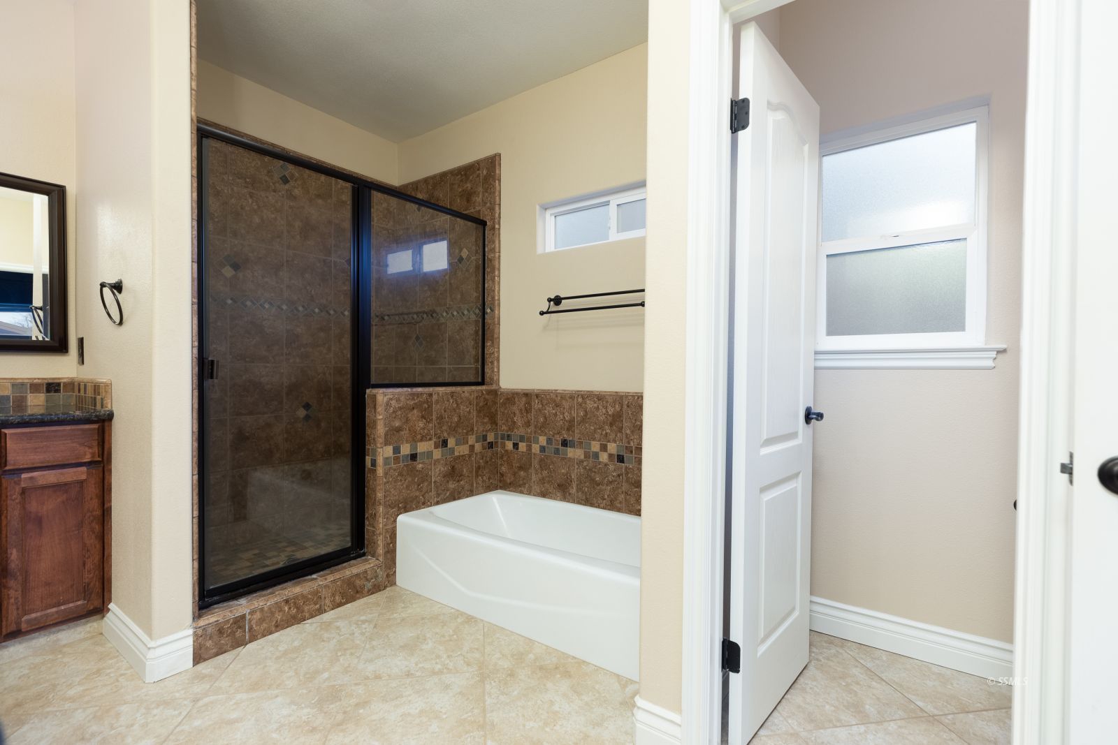 404 Christopher Court Ridgecrest, CA 93555 - Photo 18 of 31 a bathroom with a bathtub and a shower