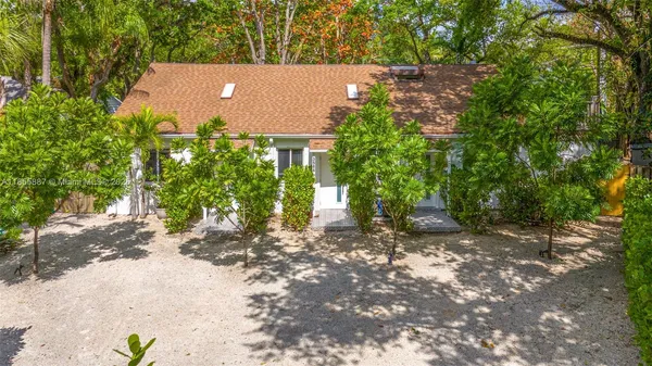 a view of house with trees in the background