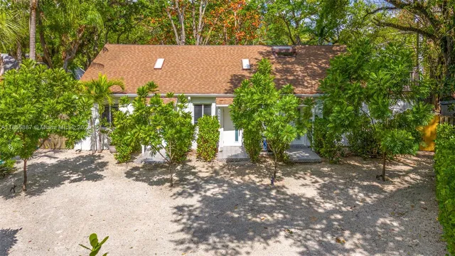 a view of house with trees in the background