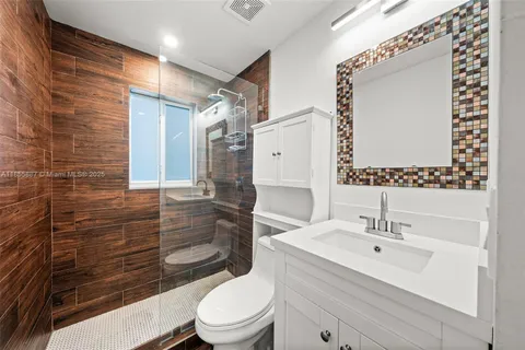 a view of a livingroom with furniture and a flat screen tv