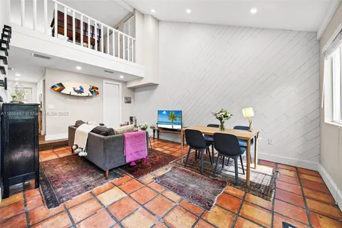 a kitchen with a sink and wooden cabinets