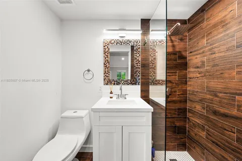 a view of a swimming pool with a patio and plants