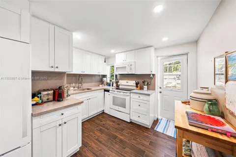 a bed room with furniture and a flat screen tv