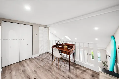 a large kitchen with a table and chairs