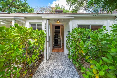 a kitchen with a sink and a stove top oven
