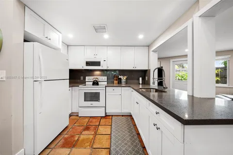 a view of kitchen with furniture and window
