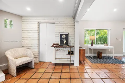 a bathroom with a sink and a large mirror