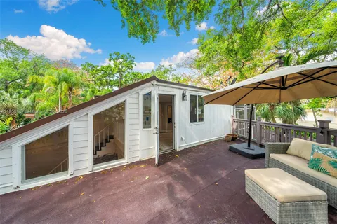 a view of a backyard with a patio