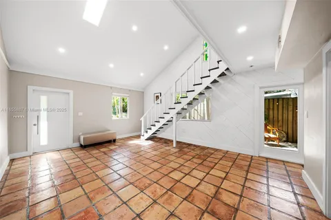 a bathroom with a sink mirror vanity and toilet
