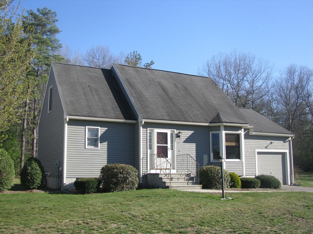 31 Country Side Road, Unit 31 Bellingham, MA 02019 - Photo 1 of 21 front view of a house with a yard