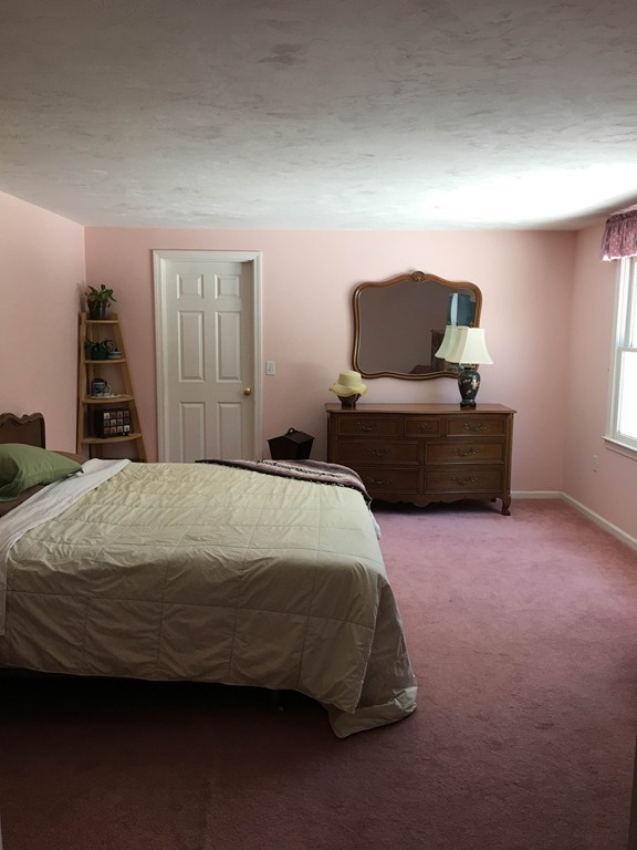 31 Country Side Road, Unit 31 Bellingham, MA 02019 - Photo 12 of 21 a bedroom with a bed and window