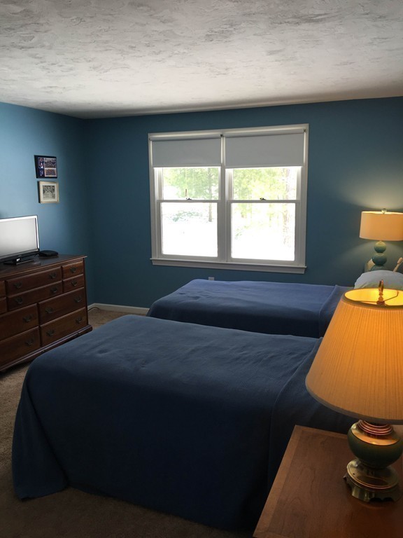 31 Country Side Road, Unit 31 Bellingham, MA 02019 - Photo 17 of 21 a bedroom with a bed and window
