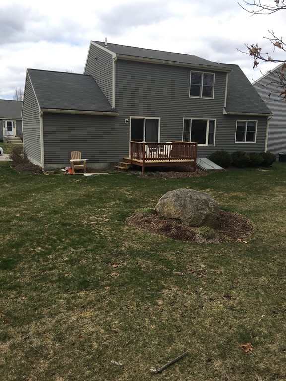 31 Country Side Road, Unit 31 Bellingham, MA 02019 - Photo 21 of 21 a view of a house with a backyard
