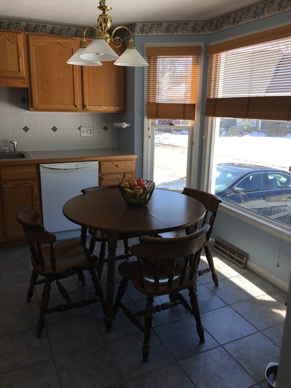 31 Country Side Road, Unit 31 Bellingham, MA 02019 - Photo 5 of 21 a dining room with furniture and window