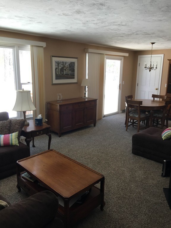31 Country Side Road, Unit 31 Bellingham, MA 02019 - Photo 9 of 21 a living room with furniture a window and a lamp