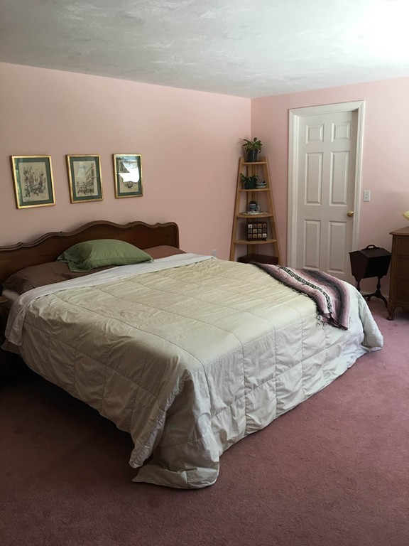 31 Country Side Road, Unit 31 Bellingham, MA 02019 - Photo 10 of 21 a bedroom with a bed and closet