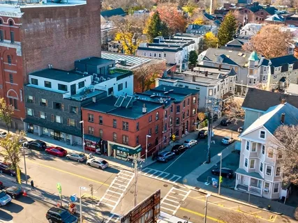 an aerial view of a building with street