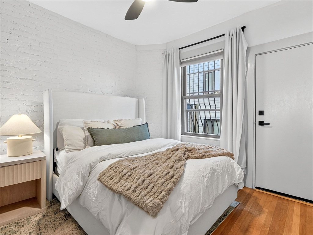 217 Boylston Street, Unit 3 Boston, MA 02130 - Photo 6 of 12 a bedroom with a bed and a window