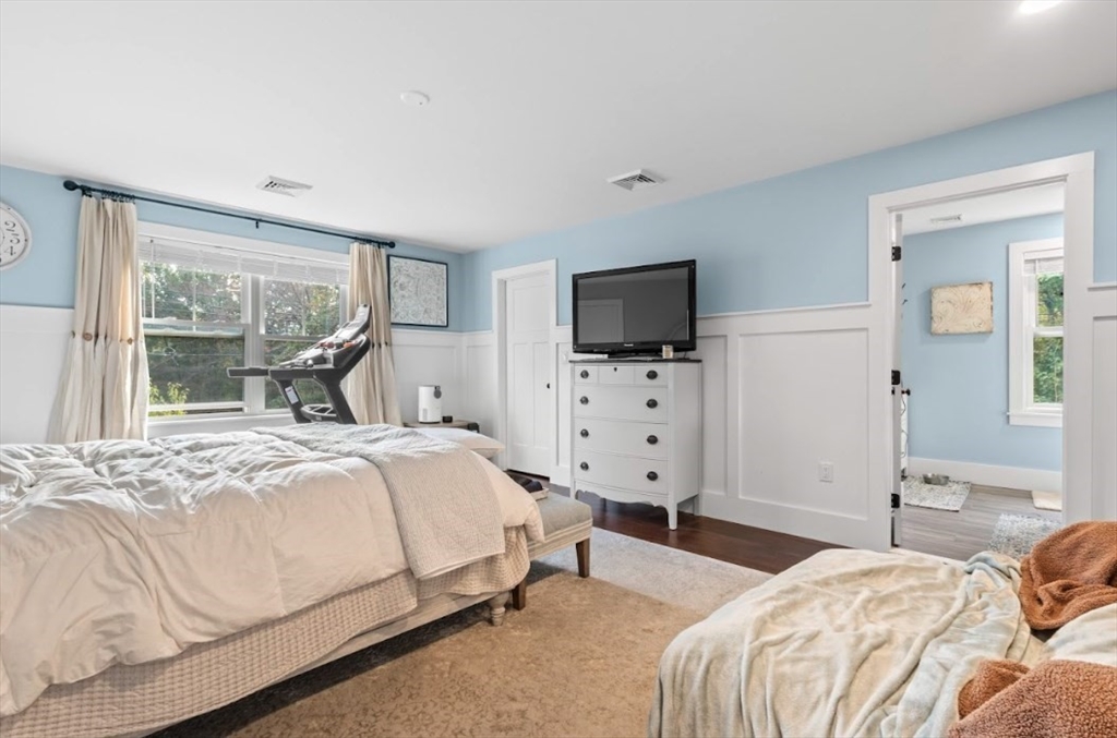90 Walnut Road North Attleboro, MA 02760 - Photo 15 of 38 a bedroom with bed and flat tv with wooden floor