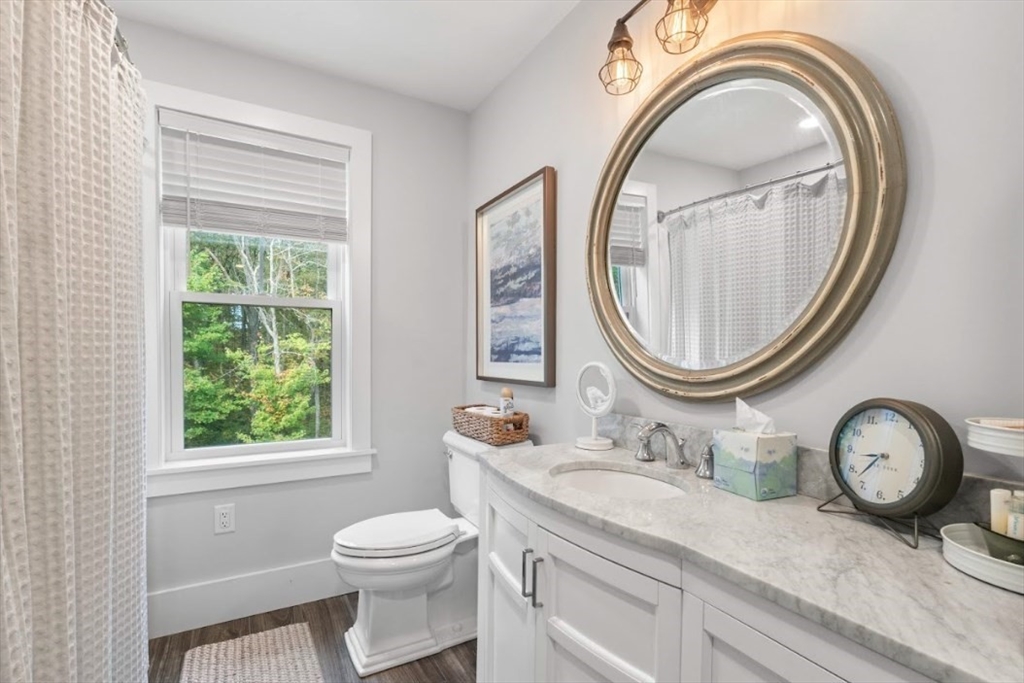 90 Walnut Road North Attleboro, MA 02760 - Photo 24 of 38 a bathroom with a granite countertop toilet a sink and a mirror