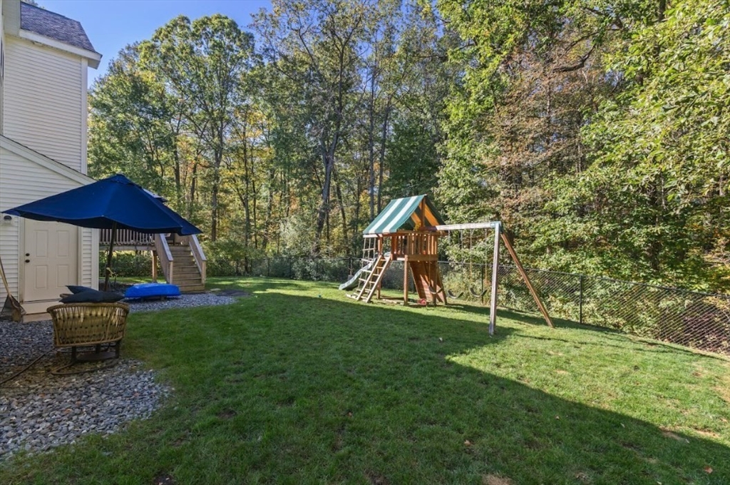 90 Walnut Road North Attleboro, MA 02760 - Photo 34 of 38 a backyard of a house with table and chairs
