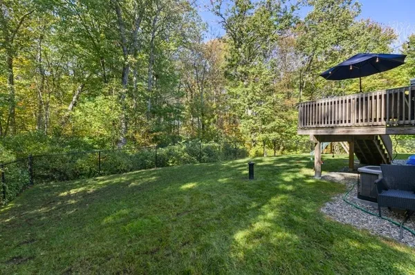 a view of a chair and table in the garden