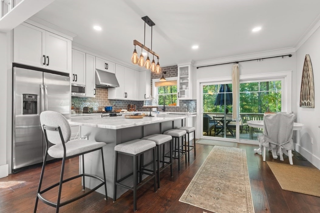 90 Walnut Road North Attleboro, MA 02760 - Photo 4 of 38 a kitchen with stainless steel appliances granite countertop a table chairs and a view of living room