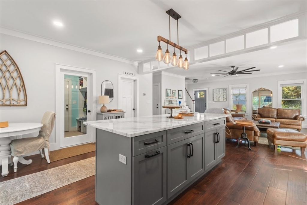 90 Walnut Road North Attleboro, MA 02760 - Photo 6 of 38 a large kitchen with lots of counter space and painting on the wall