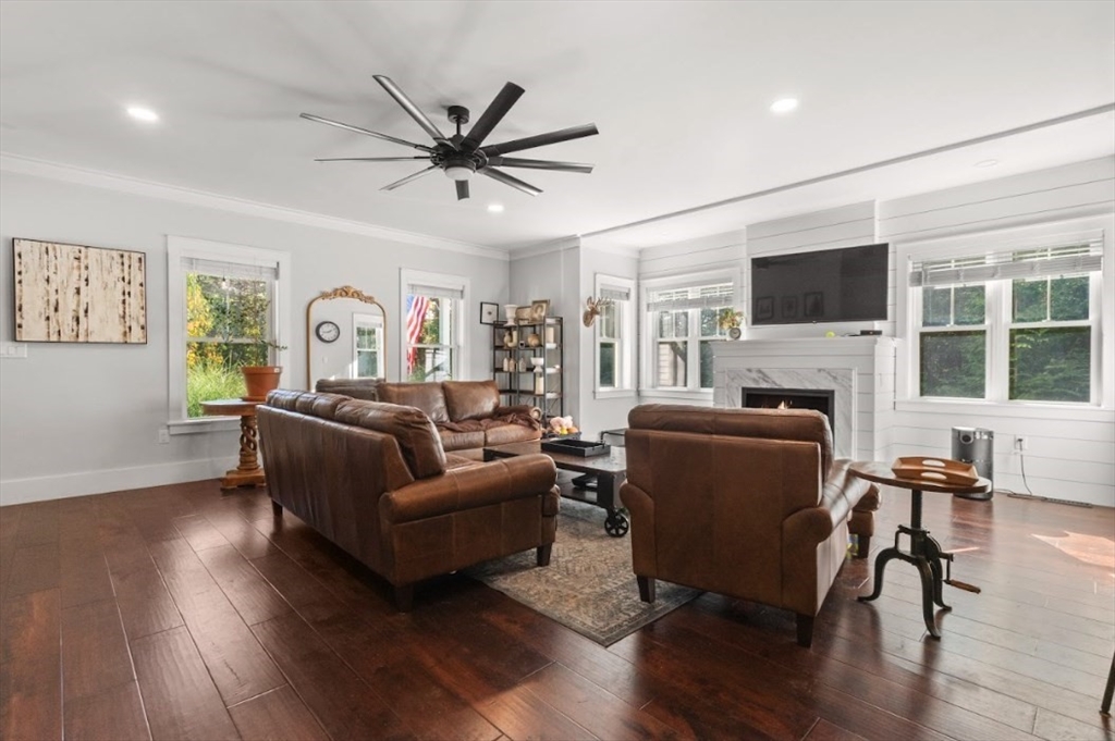 90 Walnut Road North Attleboro, MA 02760 - Photo 9 of 38 a living room with furniture a fireplace and a flat screen tv