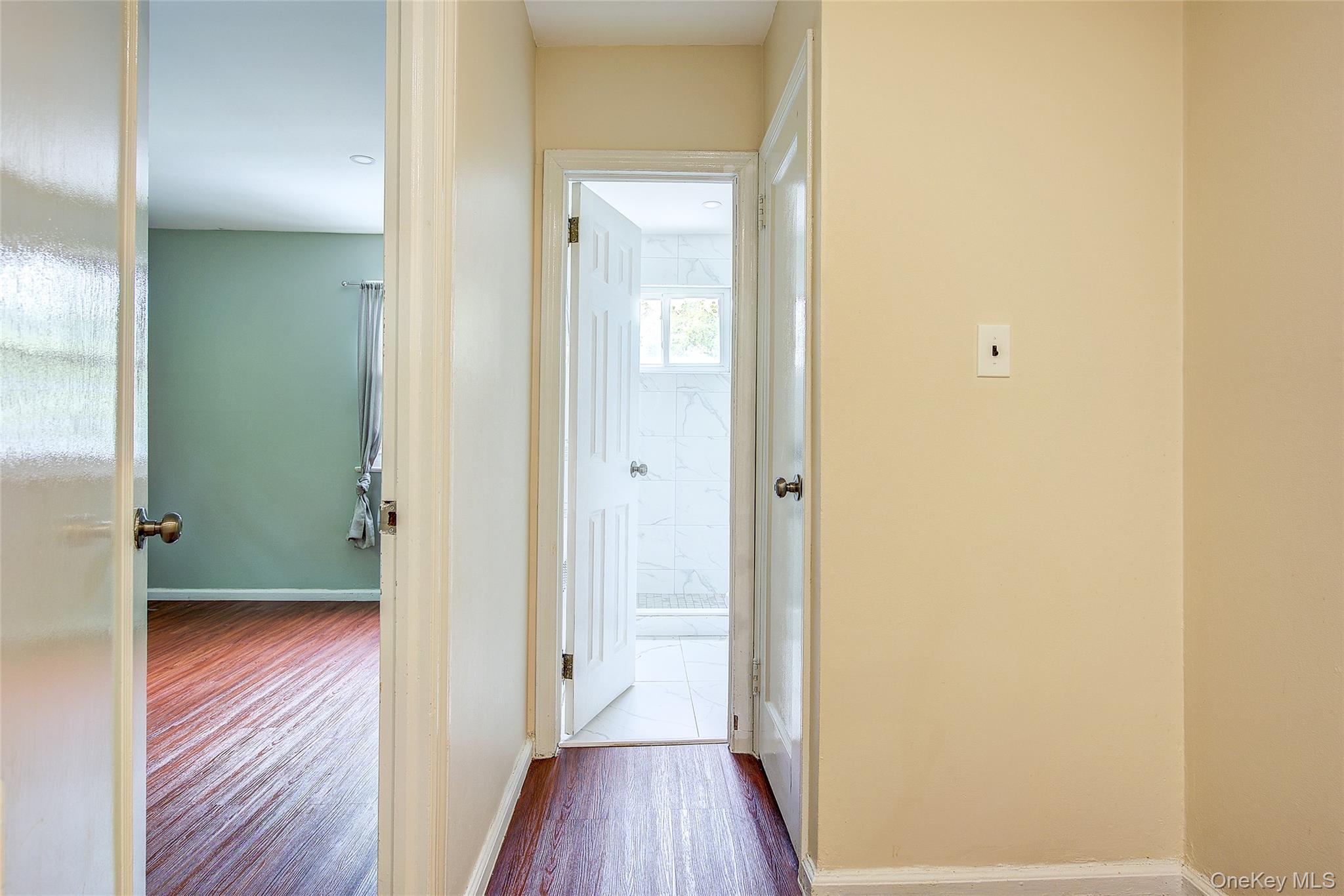 164-38 76th Road Queens, NY 11366 - Photo 15 of 44 a view of a hallway with wooden floor