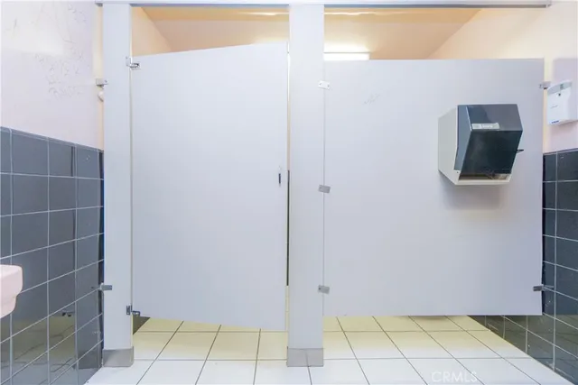 a kitchen with stainless steel appliances a stove a sink and a refrigerator