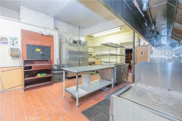 a large room with lots of counter and shower