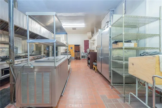 a kitchen with stainless steel appliances granite countertop a stove and a cabinets