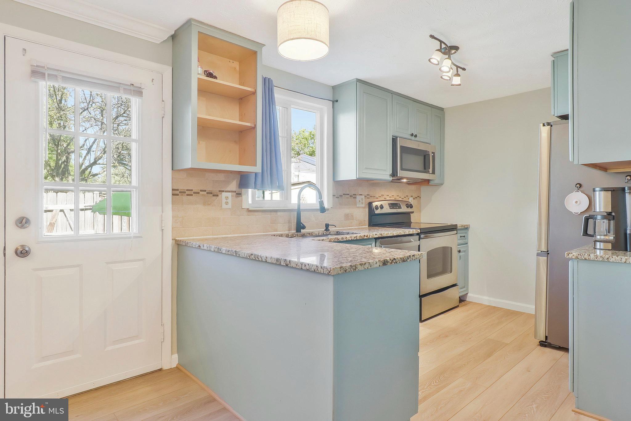 17 Willow Spring Court Germantown, MD 20874 - Photo 6 of 20 Kitchen With Exit To Fenced Back Yard With Shed
