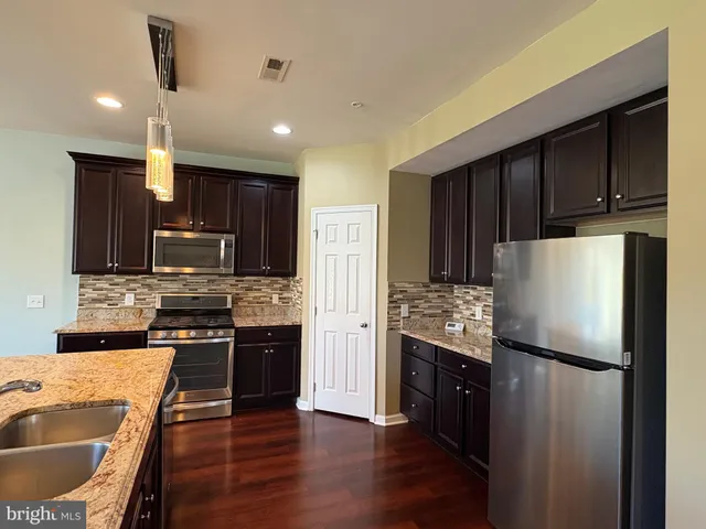 a view of a lake in middle of green field