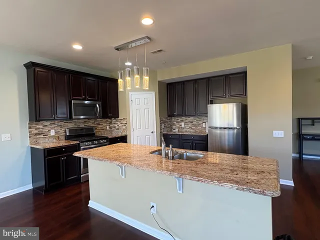 a view of a lake with a yard and outdoor seating