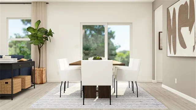 a view of a dining room with furniture window and wooden floor