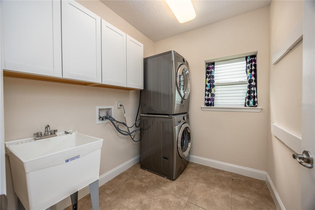 8216 Northwest 54th Street Gainesville, FL 32653 - Photo 12 of 57 a utility room with closet dryer and washer