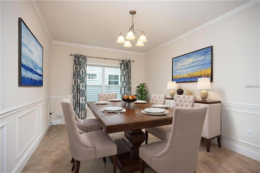 8216 Northwest 54th Street Gainesville, FL 32653 - Photo 19 of 57 a view of a dining room with furniture window and wooden floor