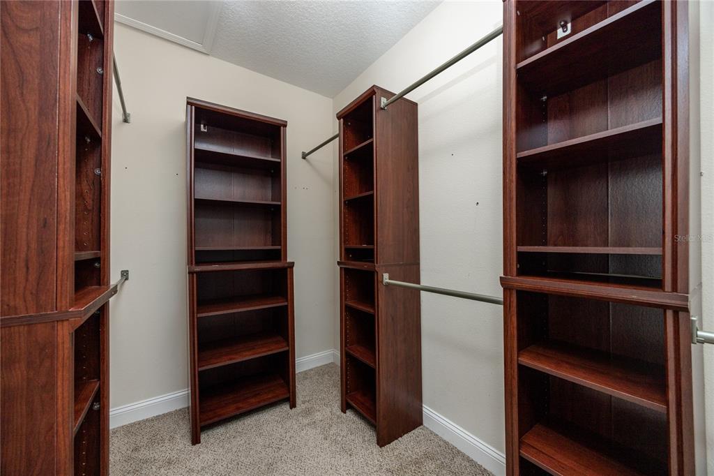 8216 Northwest 54th Street Gainesville, FL 32653 - Photo 39 of 57 a view of walk in closet with empty racks