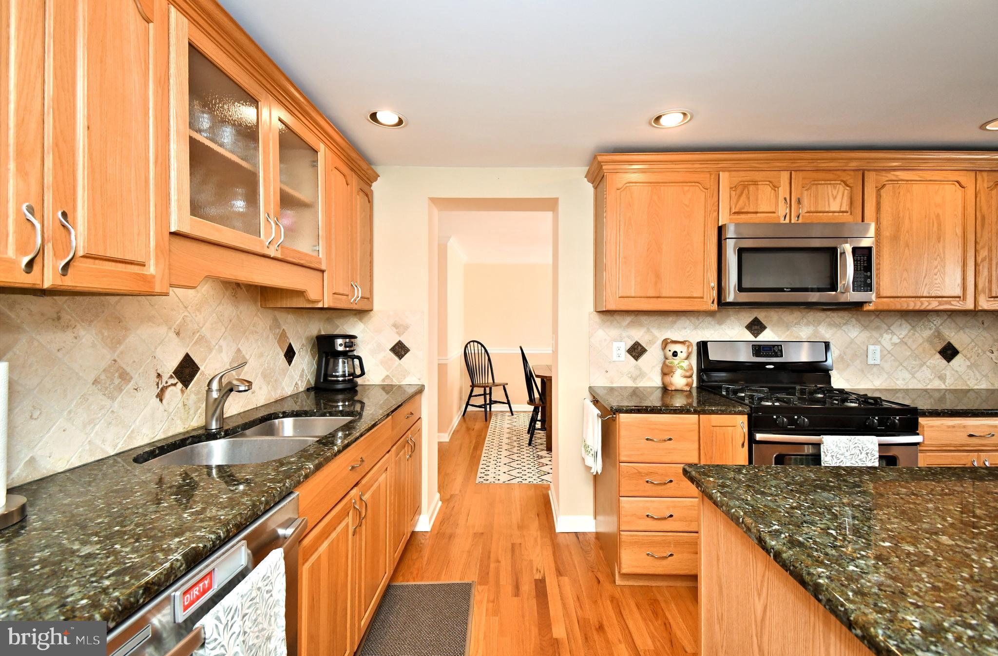 442 Oreland Mill Road Oreland, PA 19075 - Photo 14 of 68 a kitchen with granite countertop a sink a counter top space appliances and cabinets
